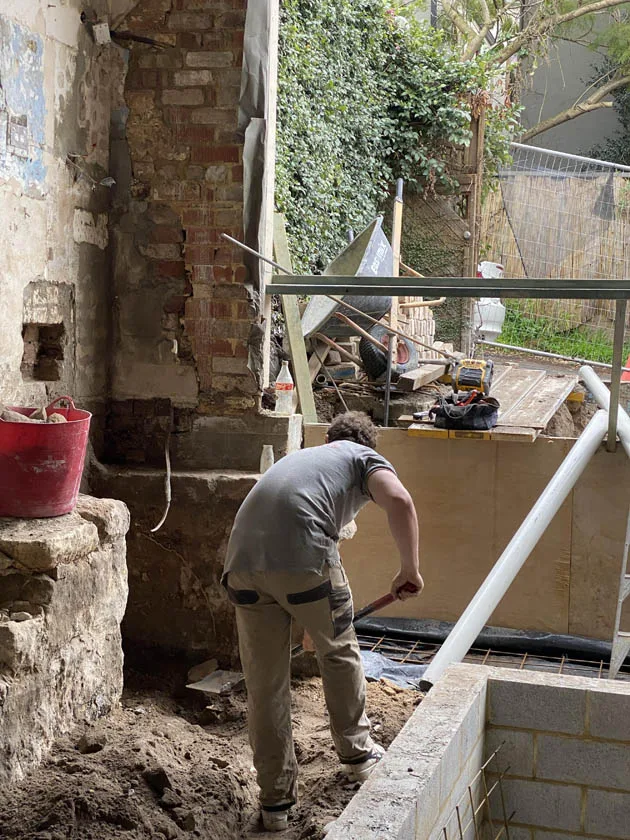 Excavating for new drainage at an older terrace home